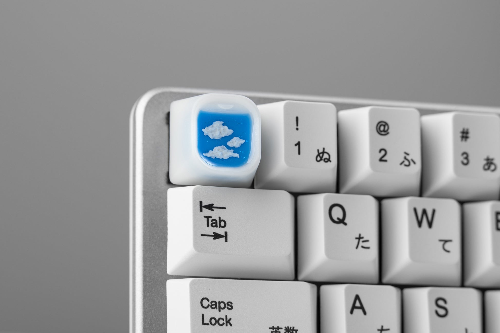 Airplane window keycap installed on keyboard, white keycaps to match