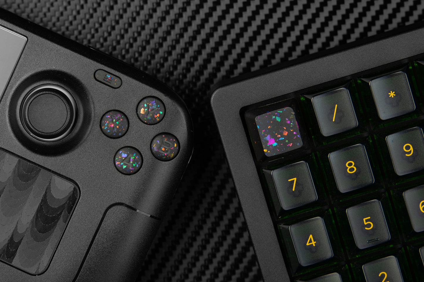Steam deck with party black ABXY buttons showing next to keyboard numpad with matching party black themed keycap