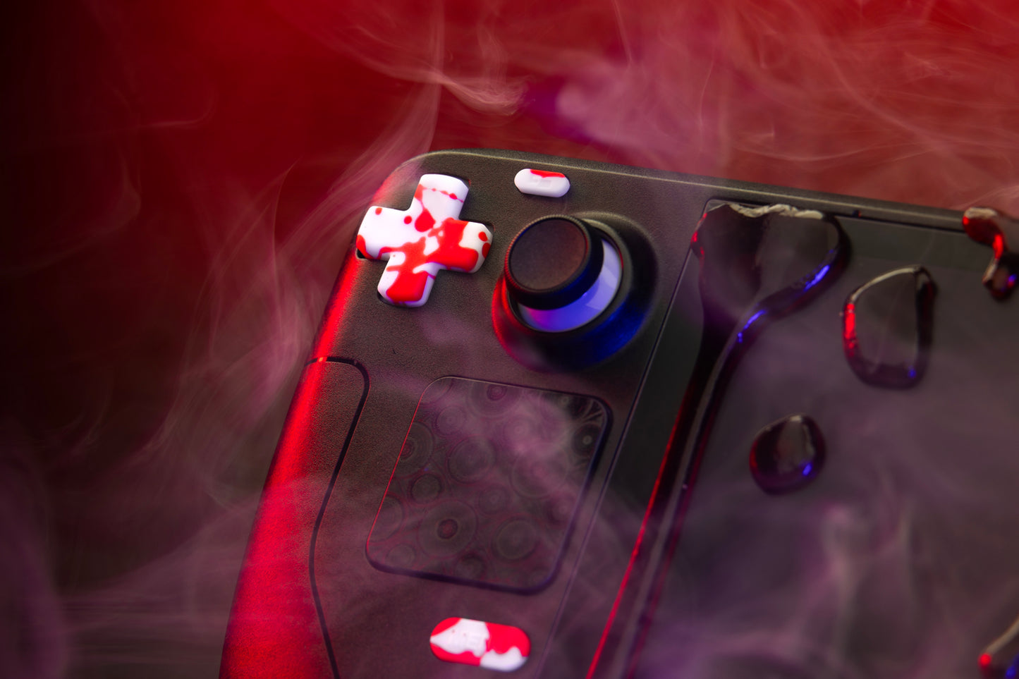 close up of blood splat dpad on steam deck. Foggy atmosphere colorful lighting.