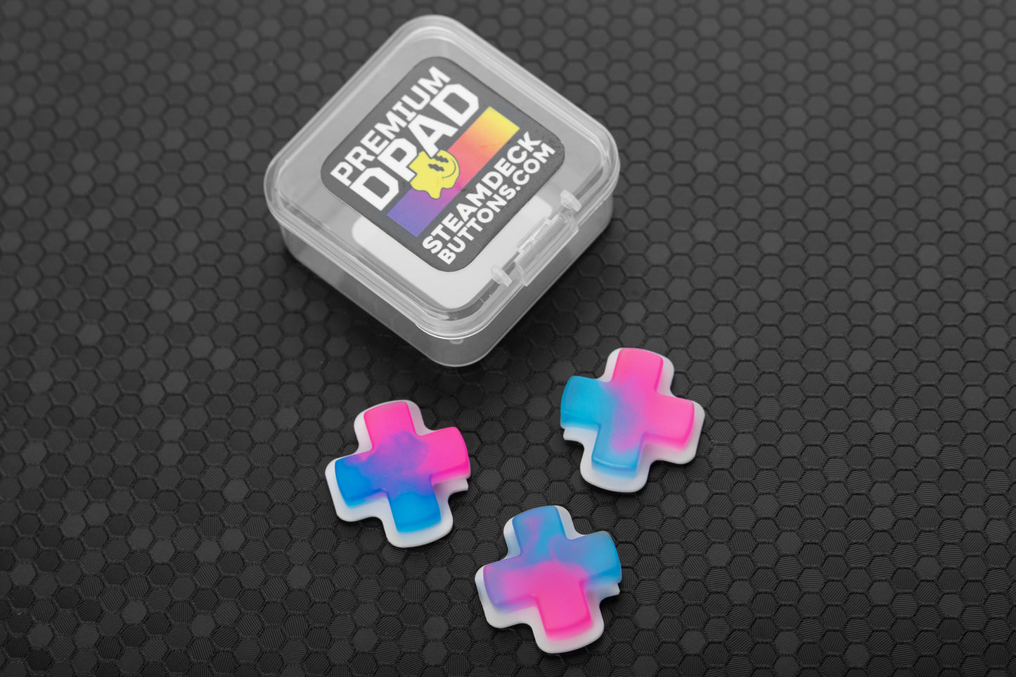 3 dpads for steam deck (neon pink and blue) in front of clamshell case