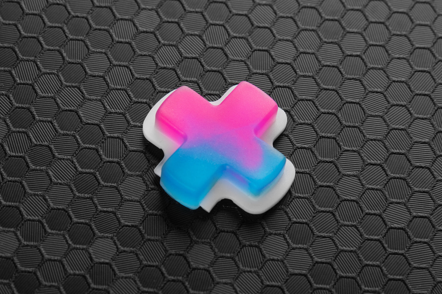 Neon pink blue gradient dpad for steam deck on top of hex background