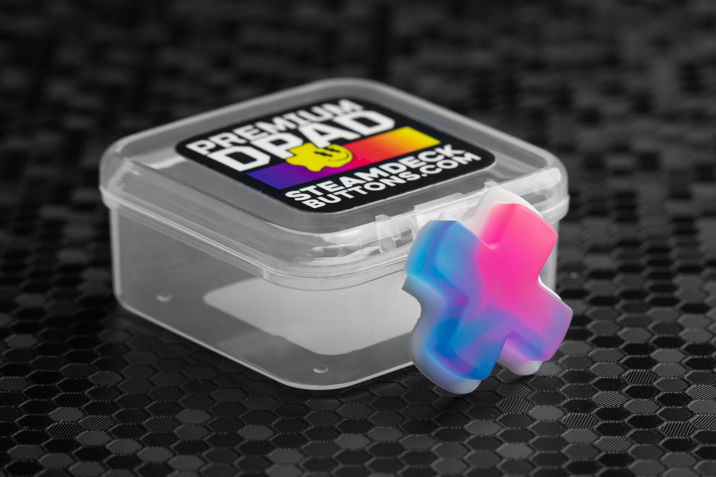 Neon blue and pink dpad for the steam deck in front of clamshell case