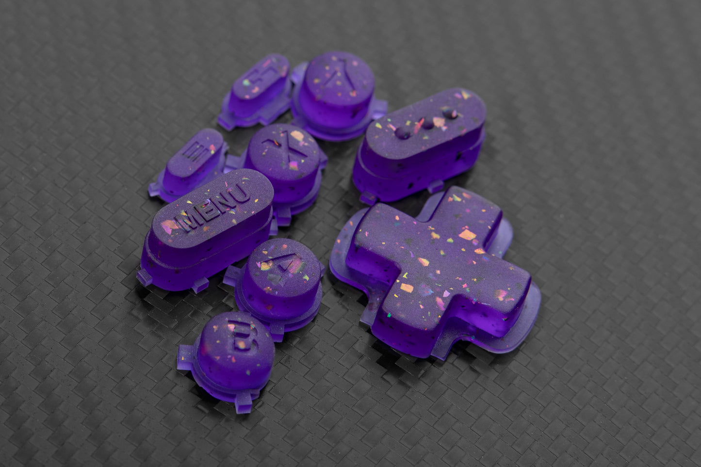 Transparent purple steam deck button set with metallic colored flakes mixed in.