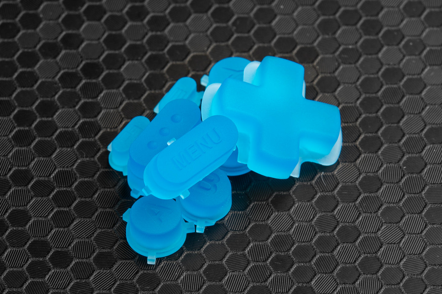 pile of steam deck buttons transparent blue showcasing menu button on honeycomb backdrop