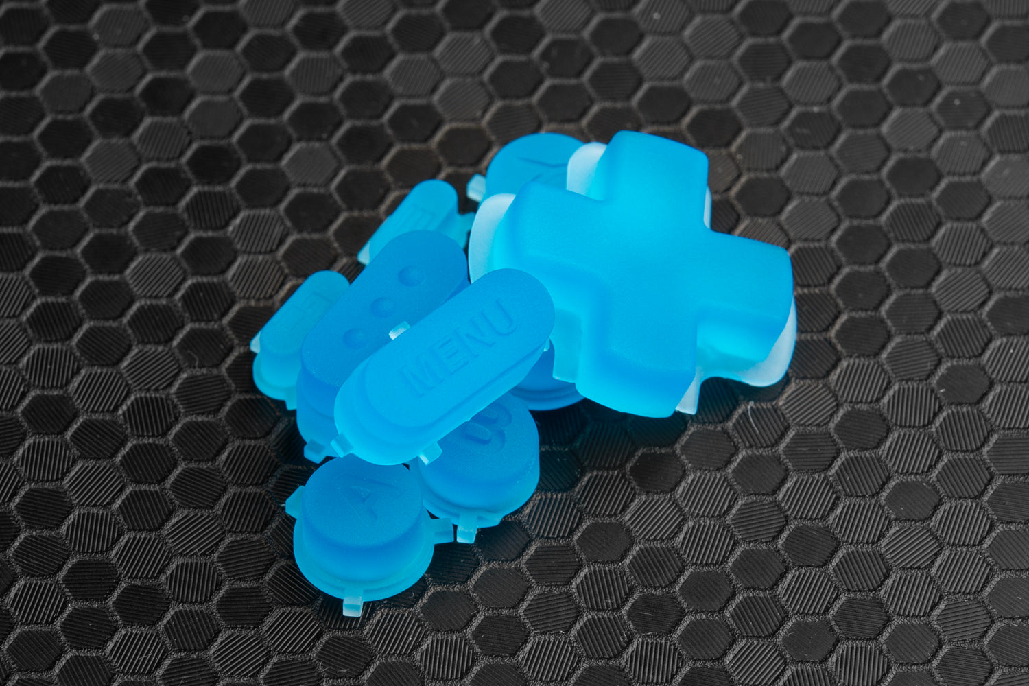 pile of steam deck buttons transparent blue showcasing menu button on honeycomb backdrop
