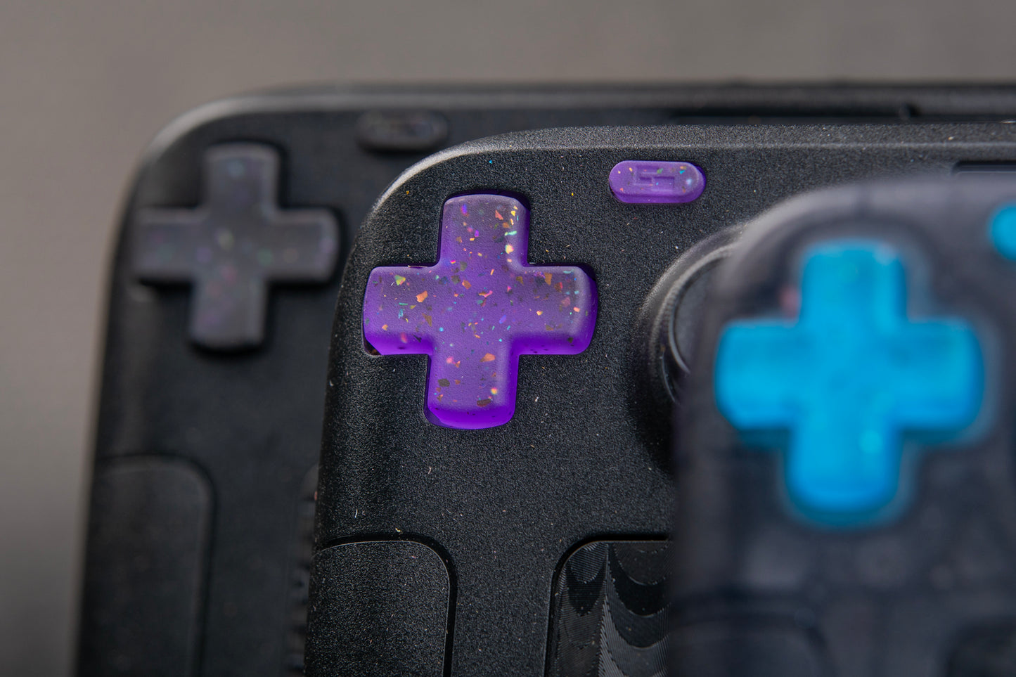 3 steam decks dpad area party purple in focus