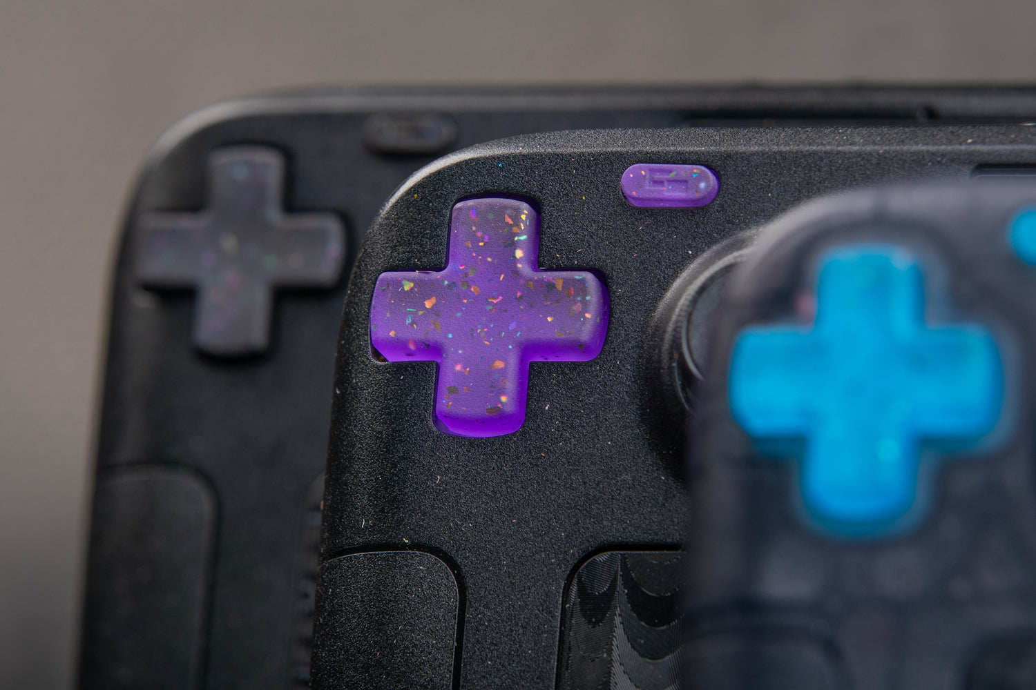 3 steam decks dpad area party purple in focus