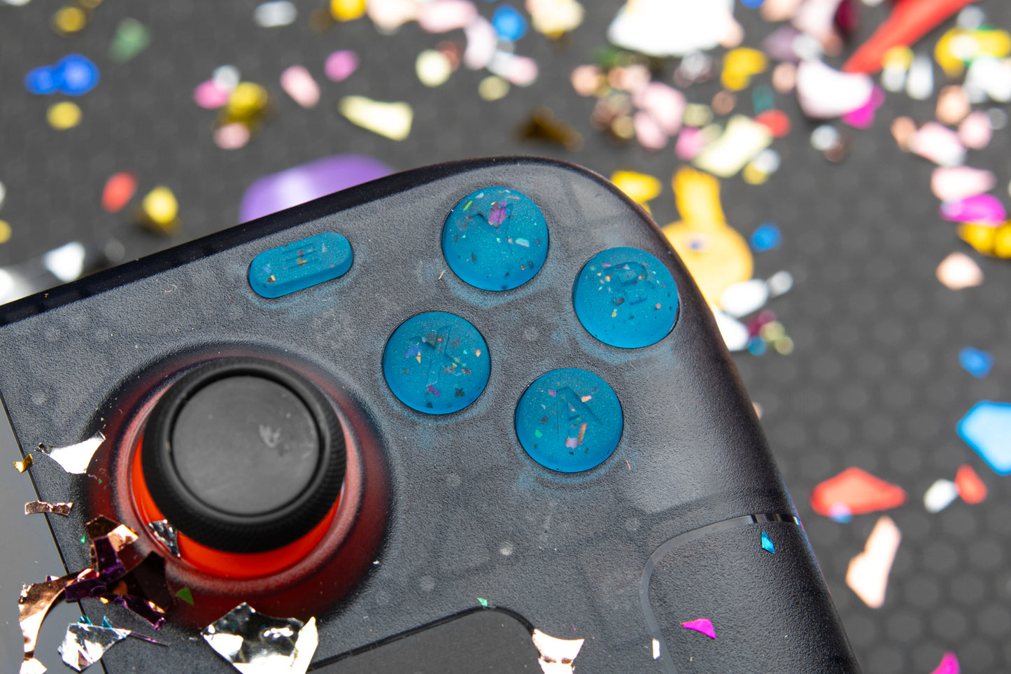 party blue steam deck buttons close up installed on steam deck. ABXY shown. Confetti background.
