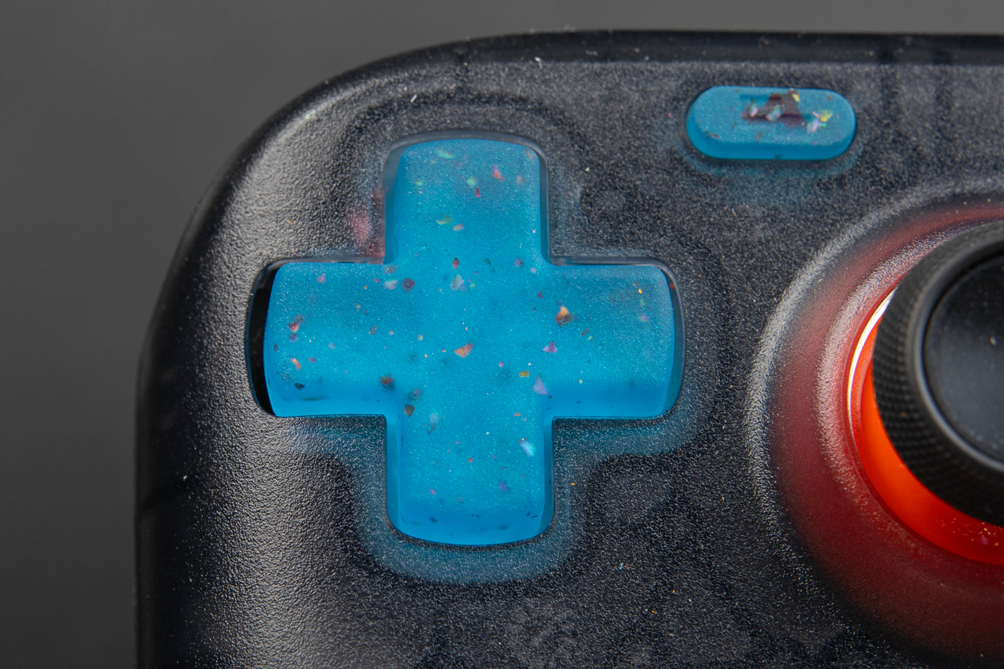 close up of party blue steam deck dpad installed in an LE model steam deck.