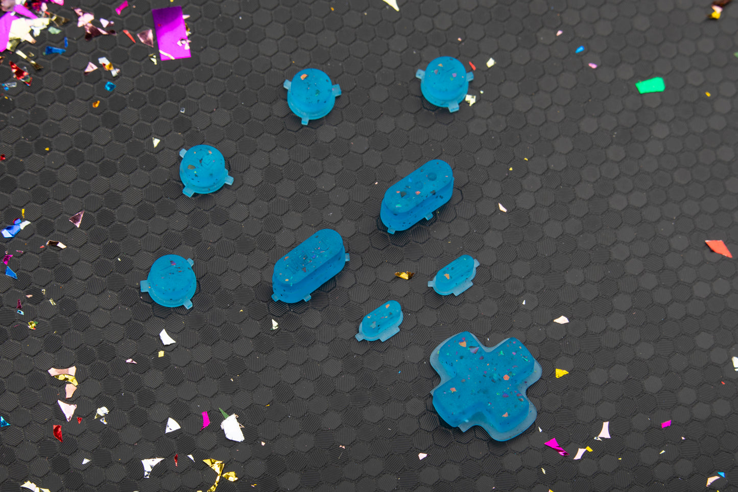 Party blue steam deck button set with confetti on hexagonal background.