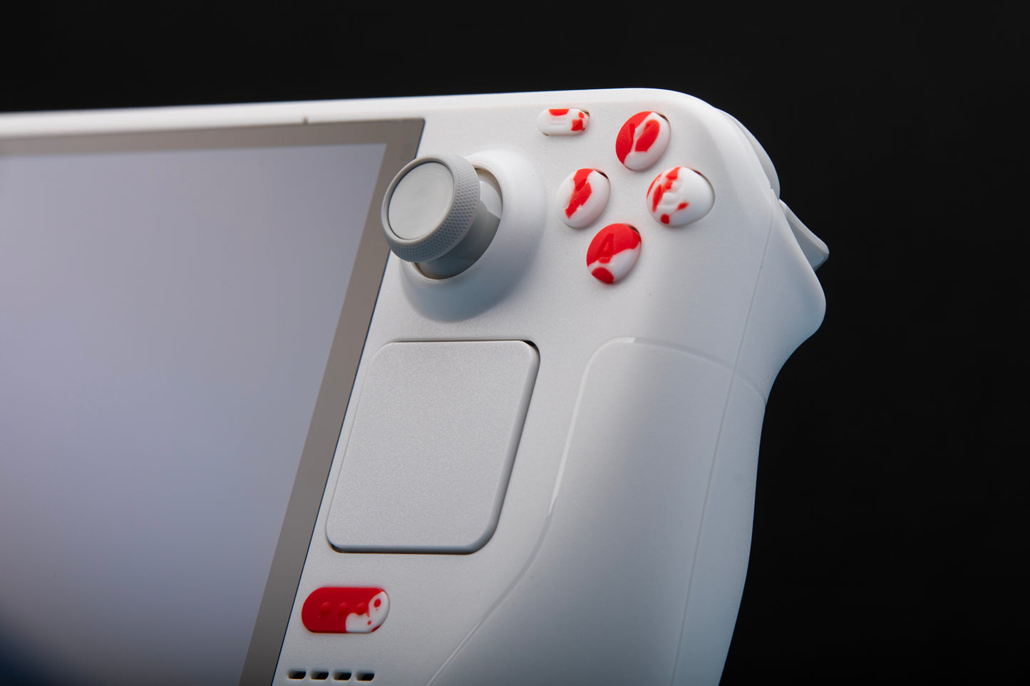 limited edition white steam deck with blood splat buttons installed. ABXY close up