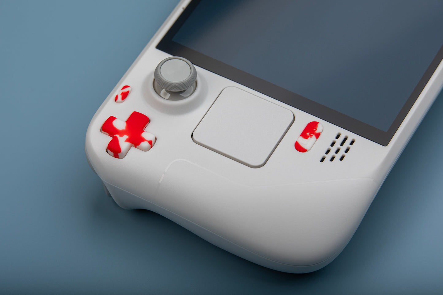 white limited edition steam deck with custom blood splatter buttons installed