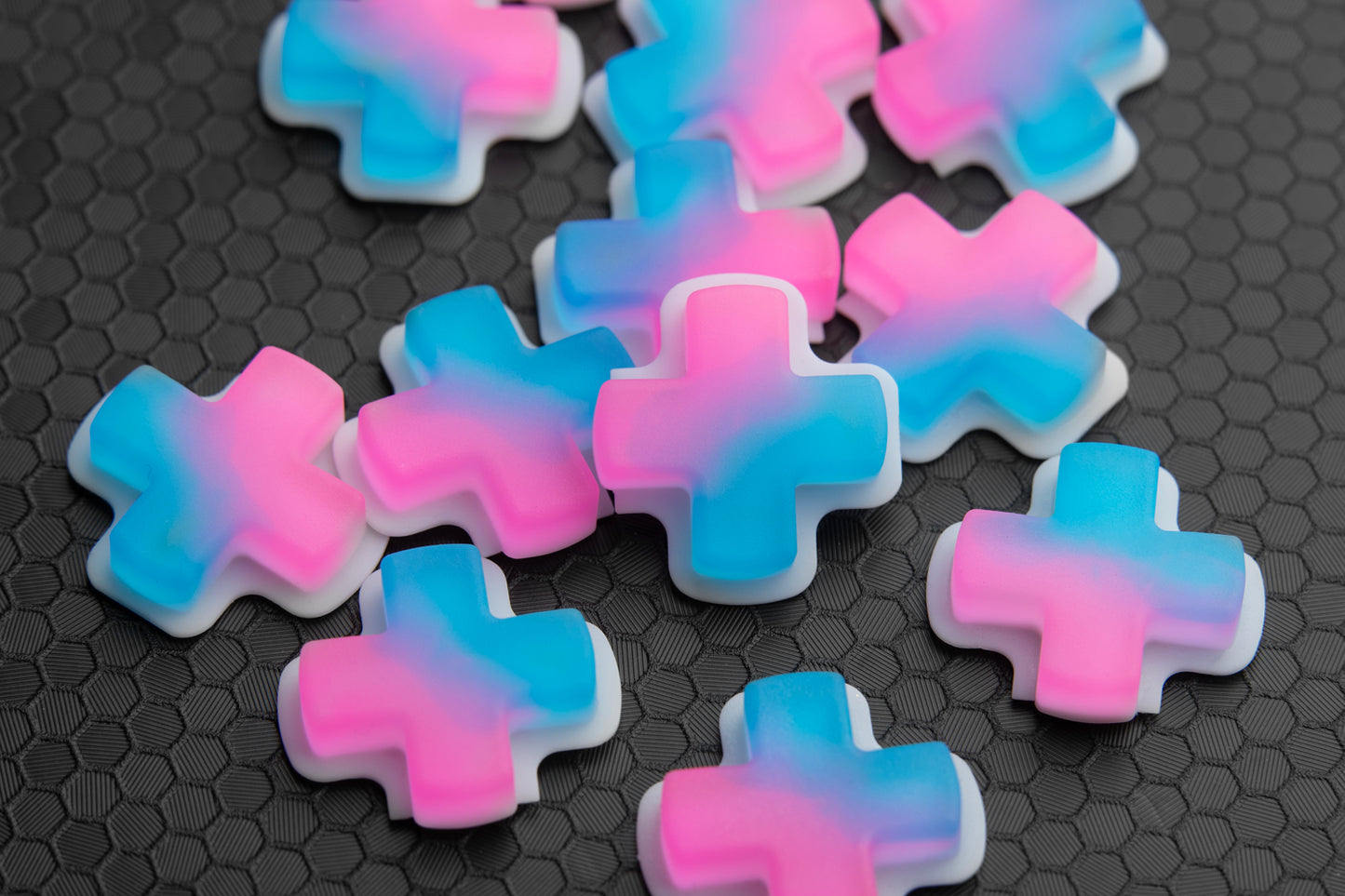 plile of steam deck dpads with pink and blue gradient