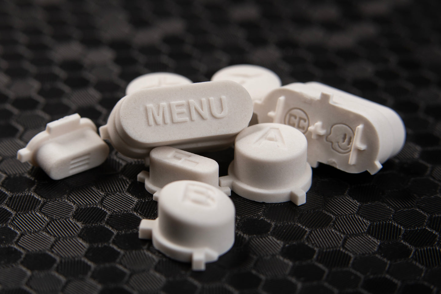 pile of stone steam deck dpads, showcasing menu button