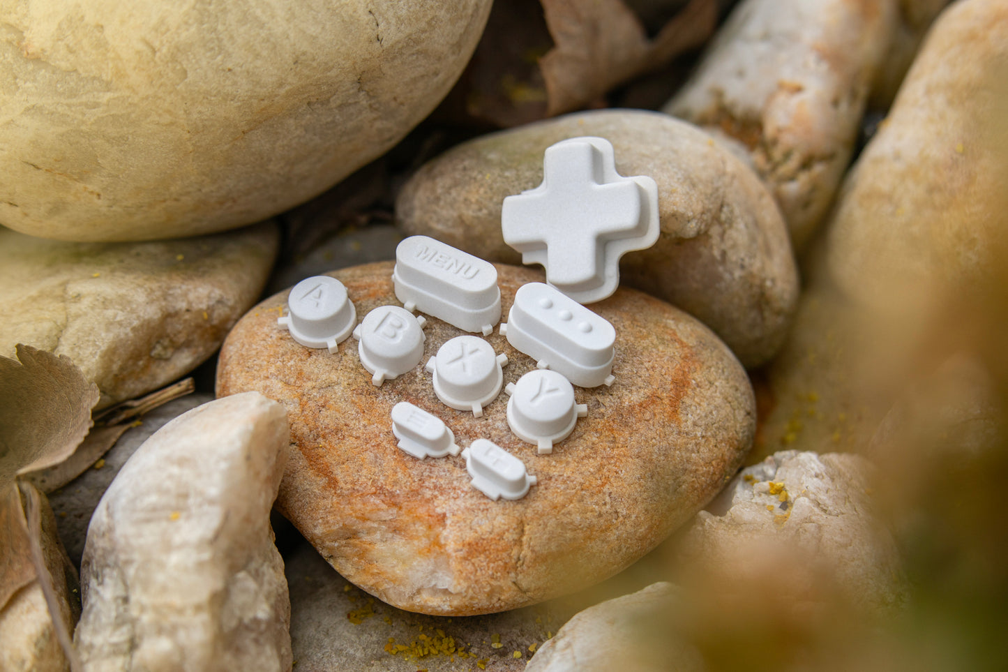 Stone steam deck dpad full set sitting on a rock