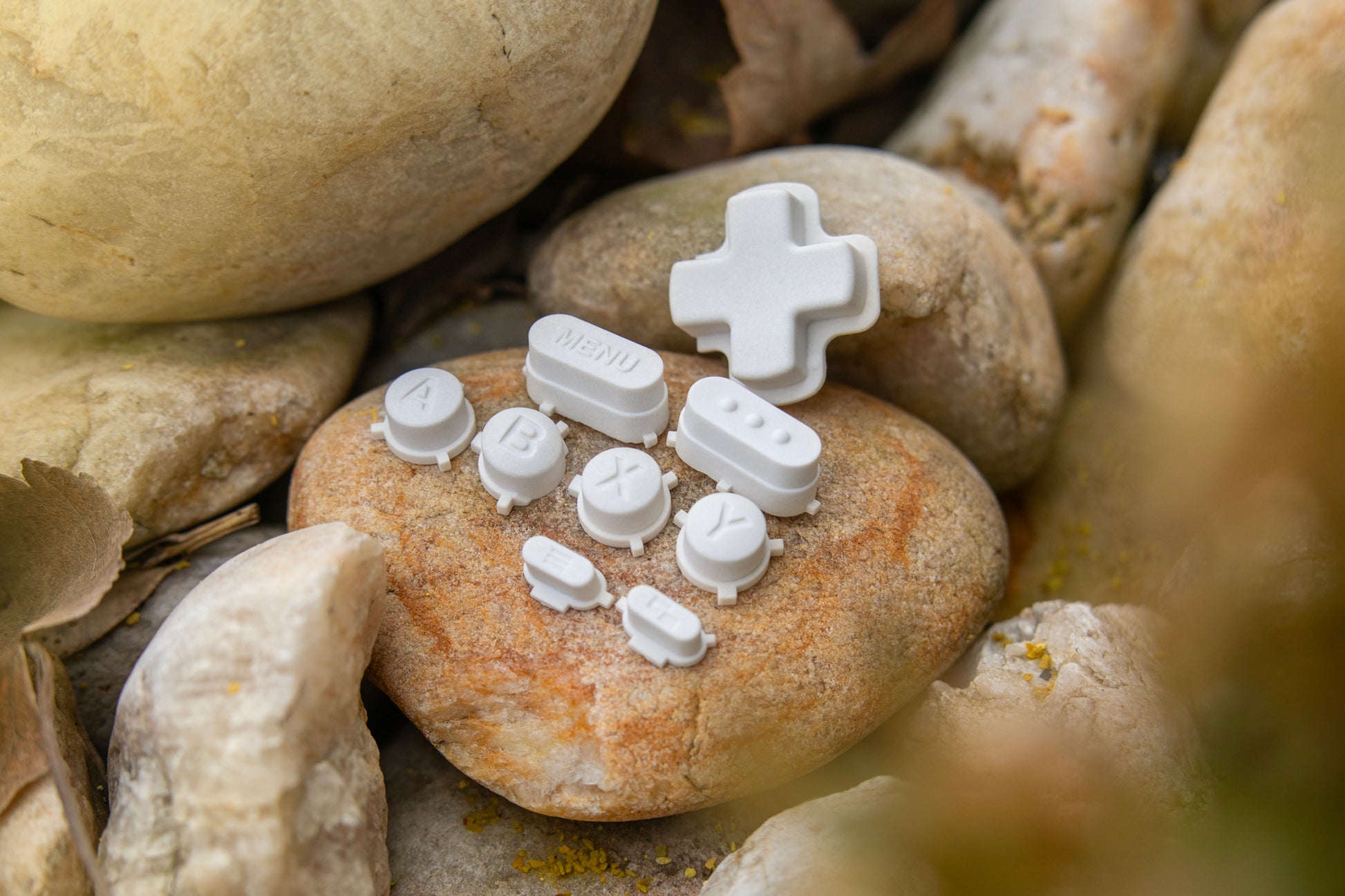 Stone steam deck dpad full set sitting on a rock