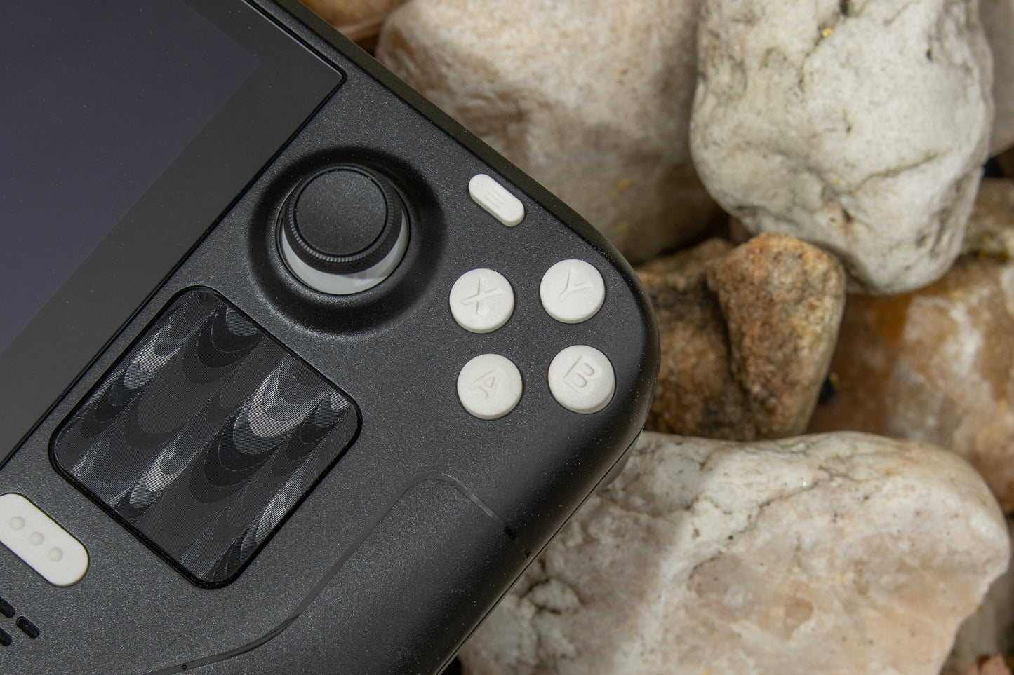 Stone steam deck abxy set atop real stone bg