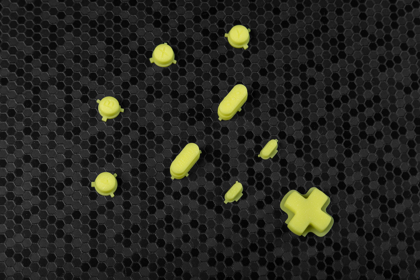 sparkly yellow steam deck button set on hex background