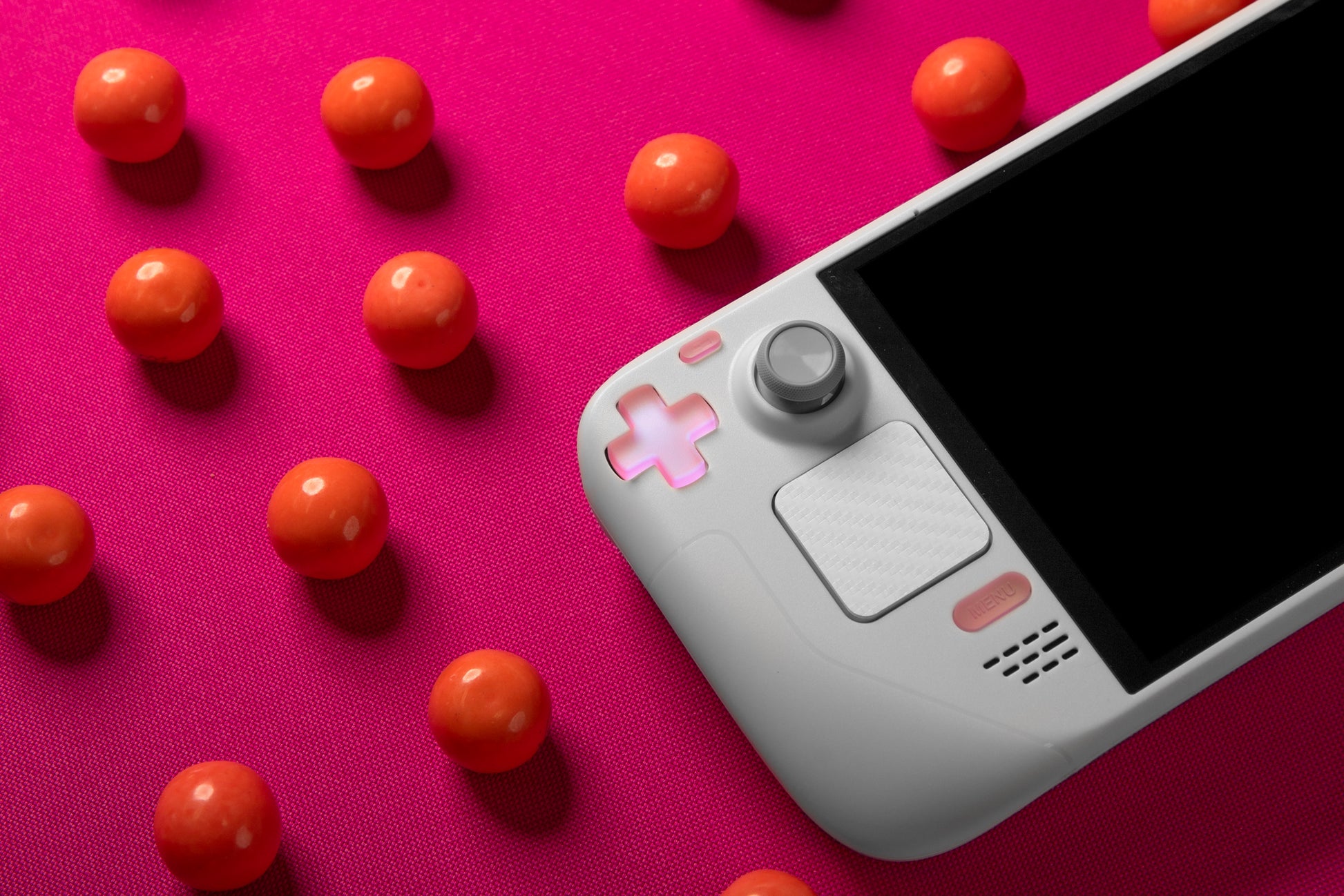 pink color shift dpad in white steam deck with gumballs in scene