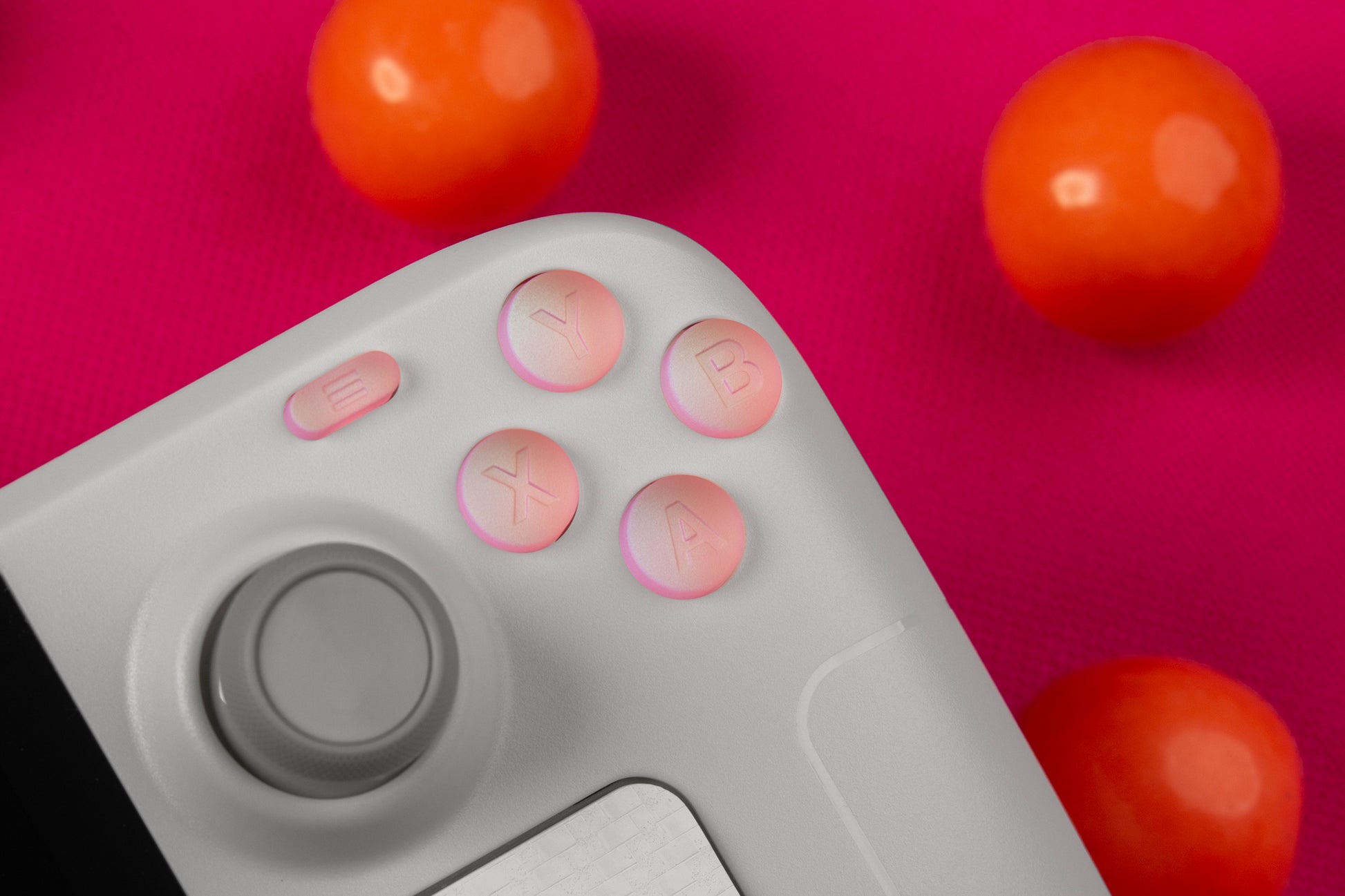Pink, champagne, and blueish color shift steam deck buttons abxy. Gumballs around