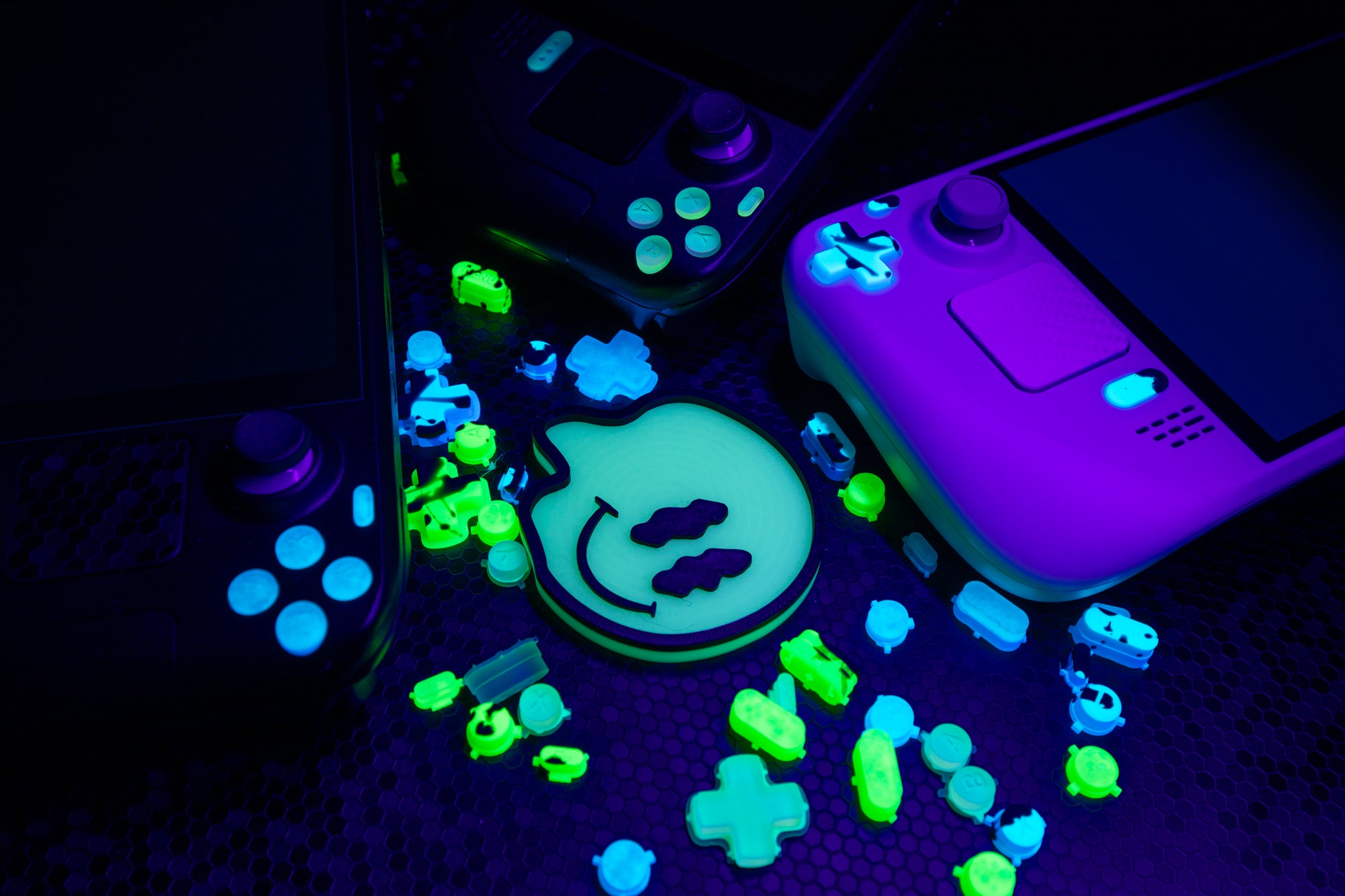 steam decks and buttons all glowing in the dark