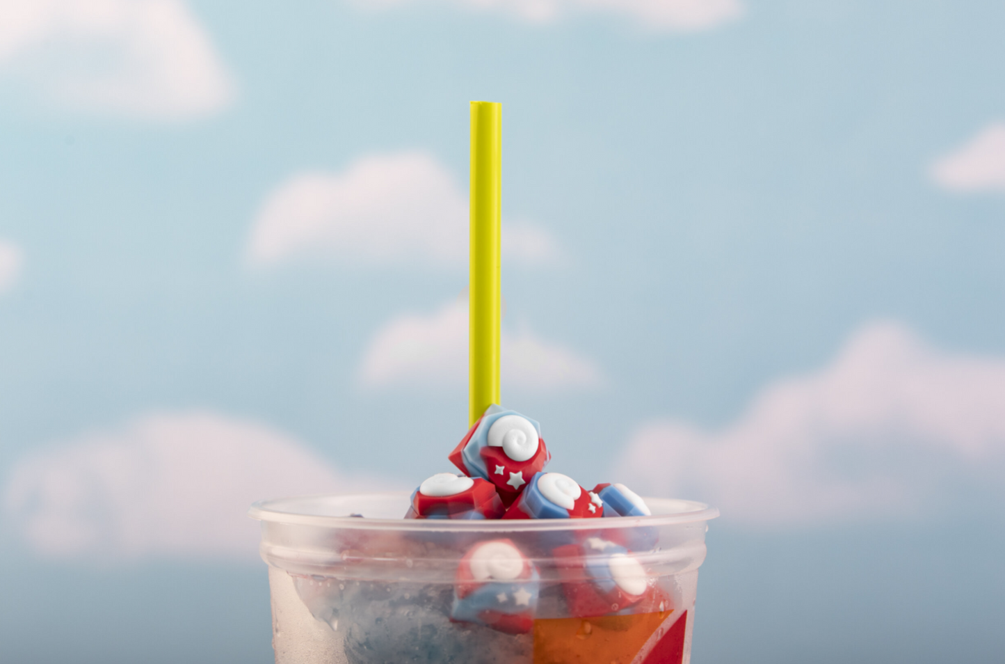 Animal crossing themed keyboard key inside a cup with straw sticking out