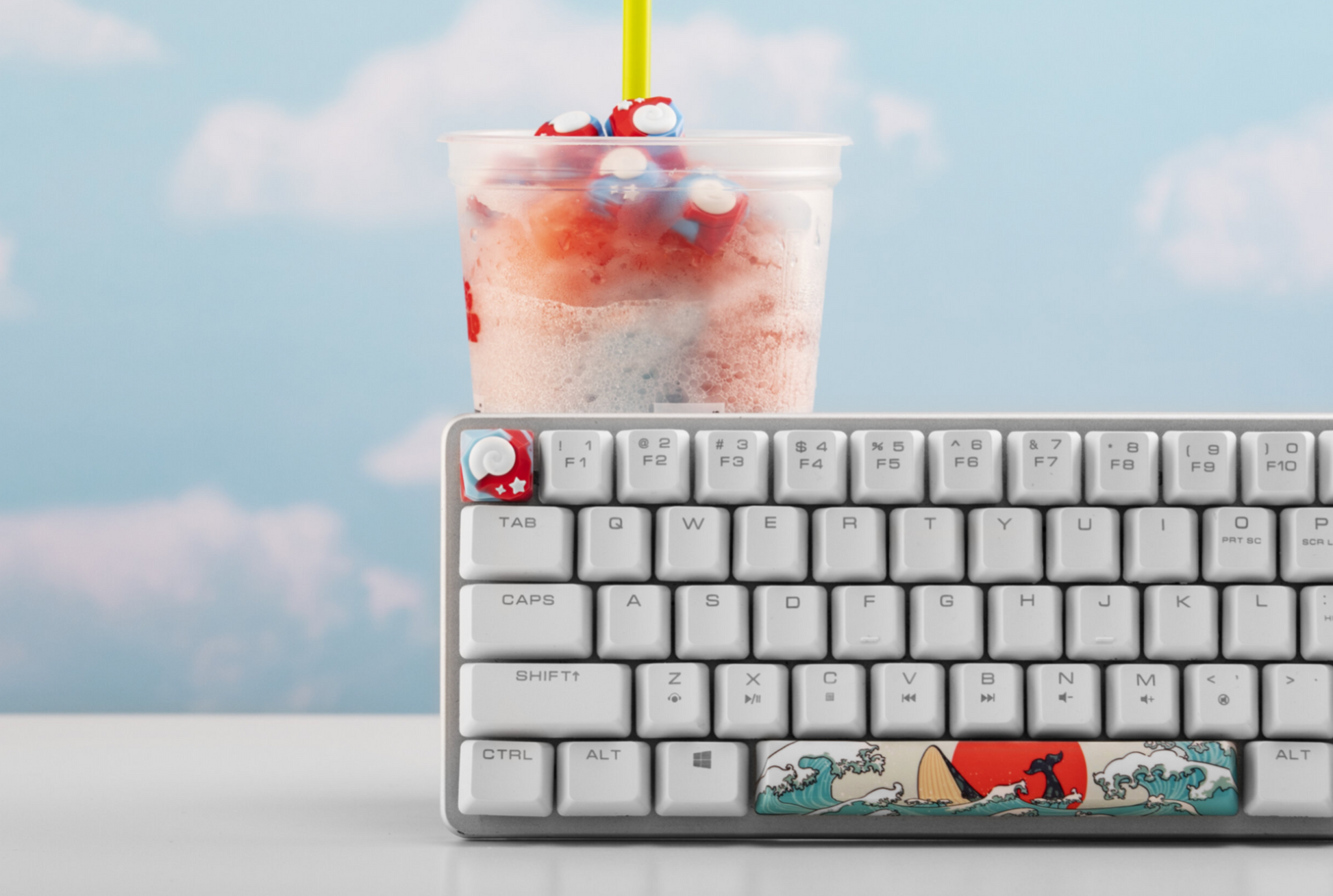 Animal crossing keyboard key installed on a keyboard with a slurpee behind it