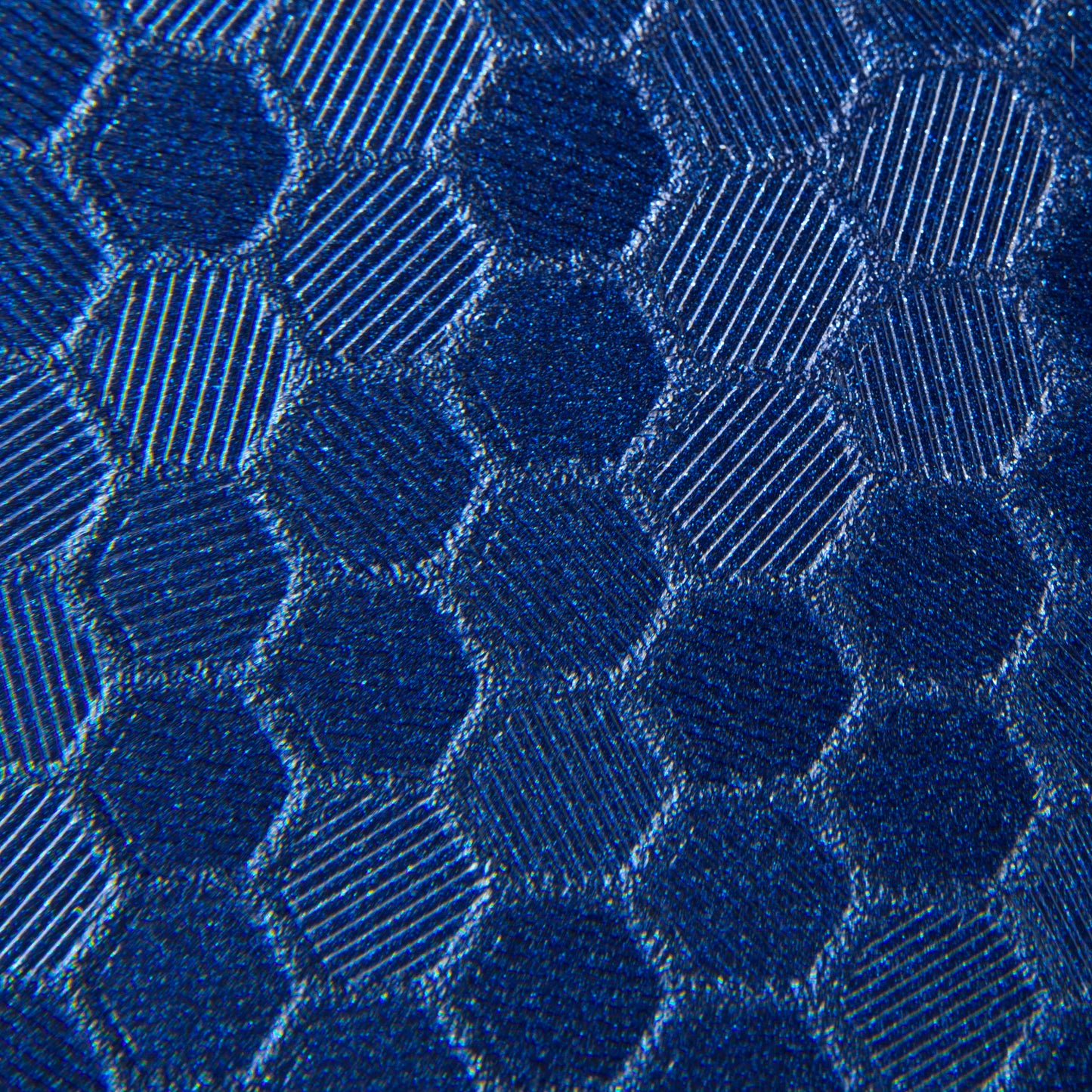 close up swatch of blue hex pattern. Hexagonal shapes with cross hatching in between