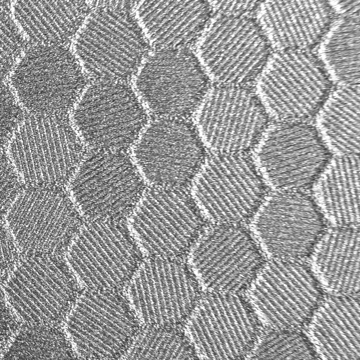 close up swatch of silver hex pattern. Hexagonal shapes with cross hatching in between