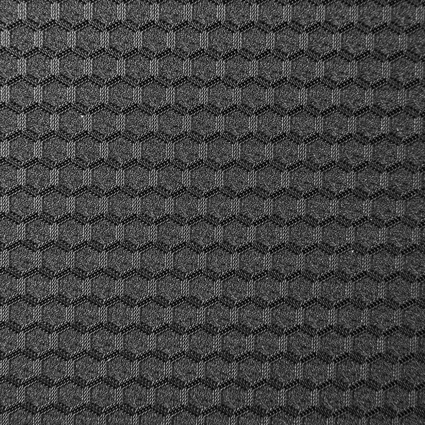 close up swatch of black minihex pattern. Hexagonal shapes