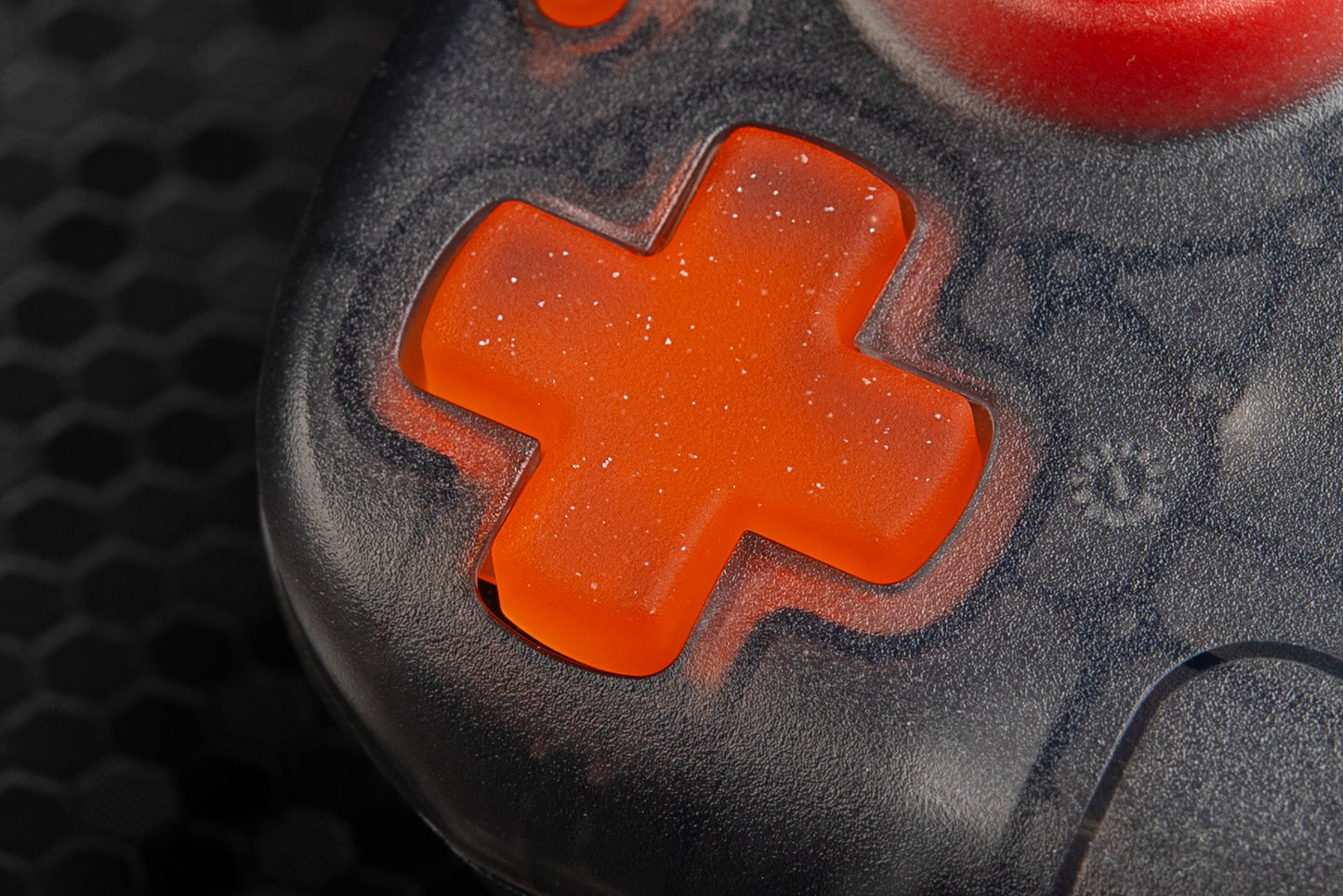 close up of orange dpad installed in steam deck showcasing the texture