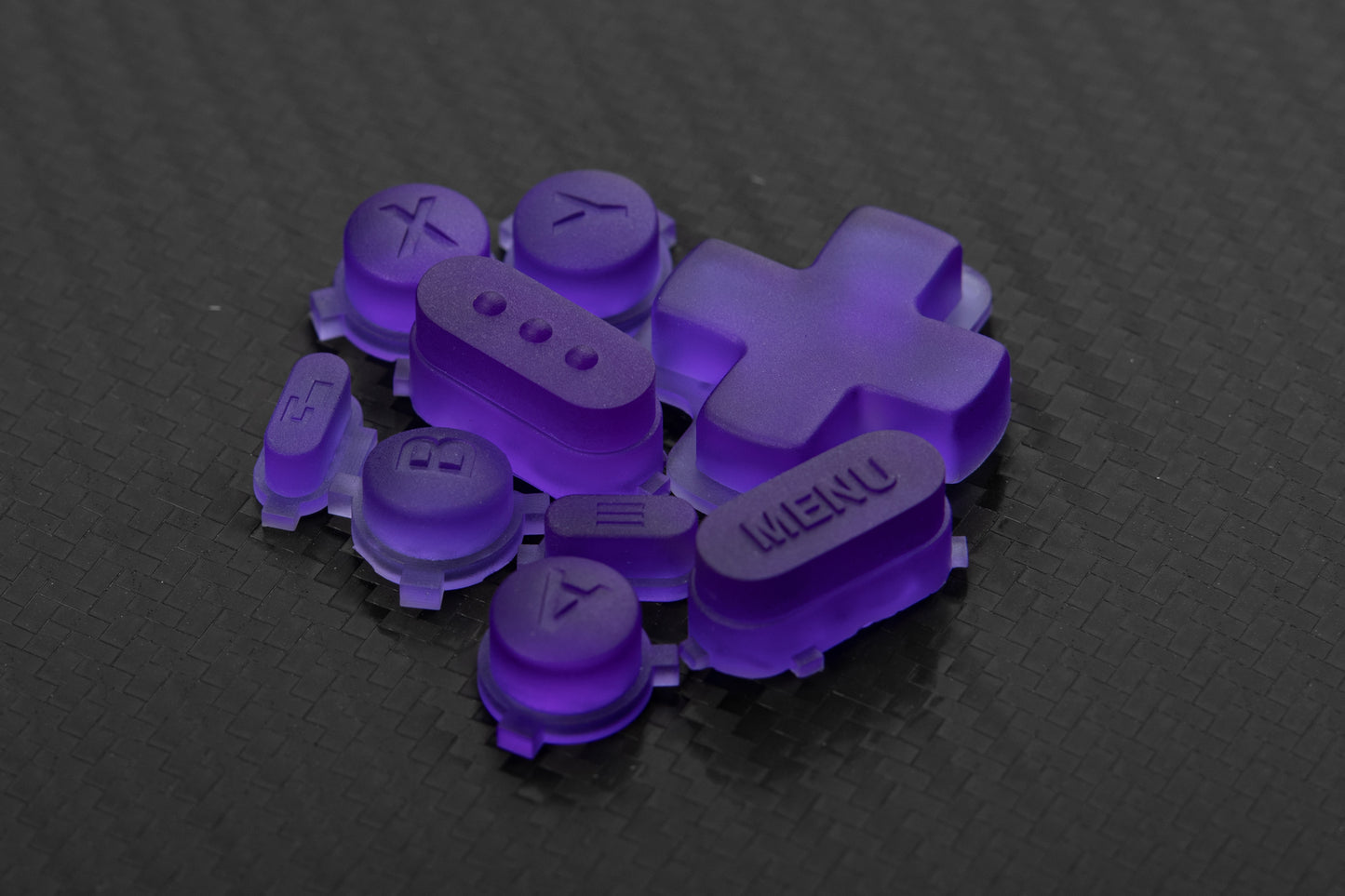 transparent purple steam deck buttons in a loose pile