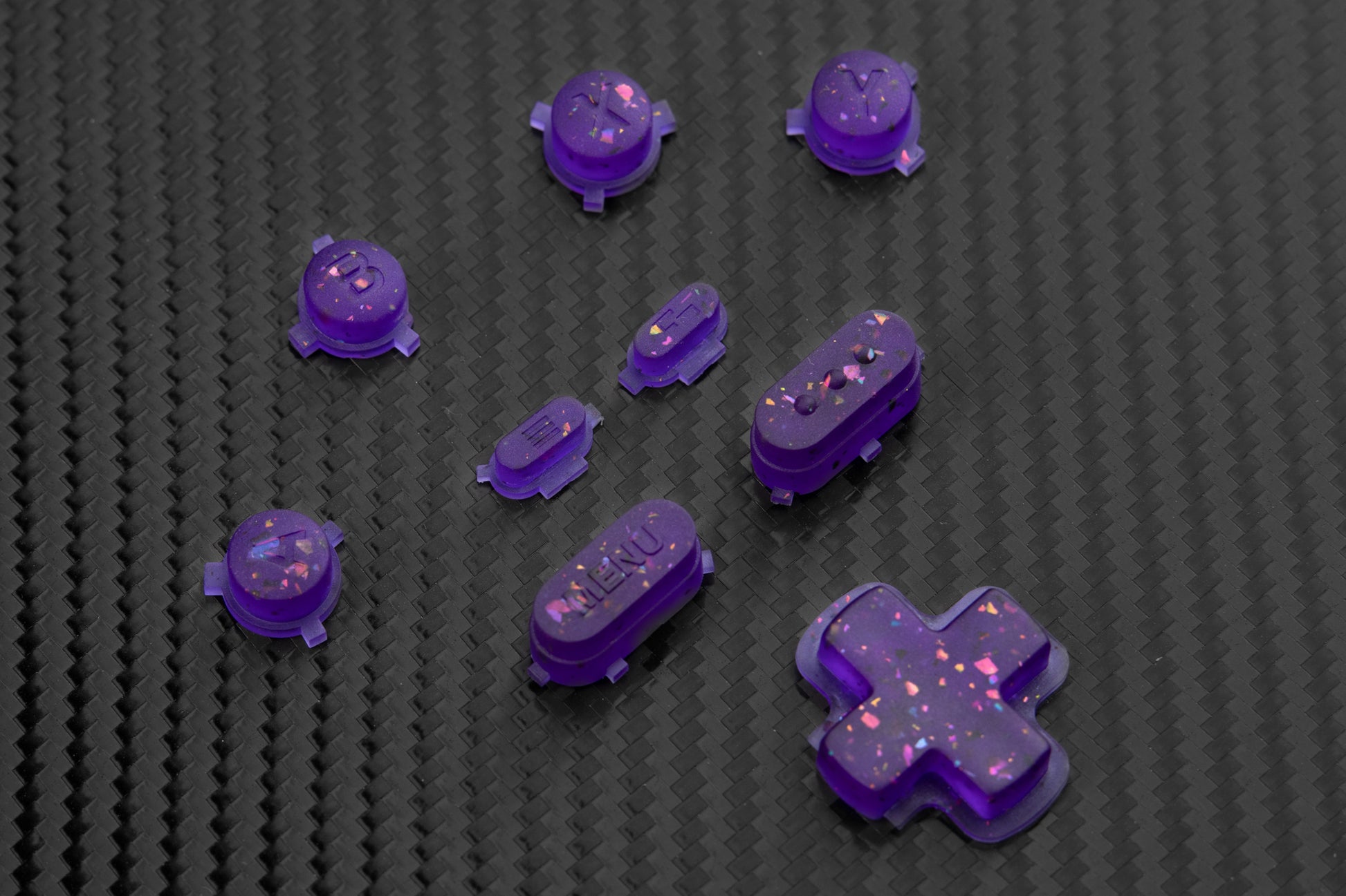 Transparent purple steam deck button set with metallic colored flakes mixed in. 
