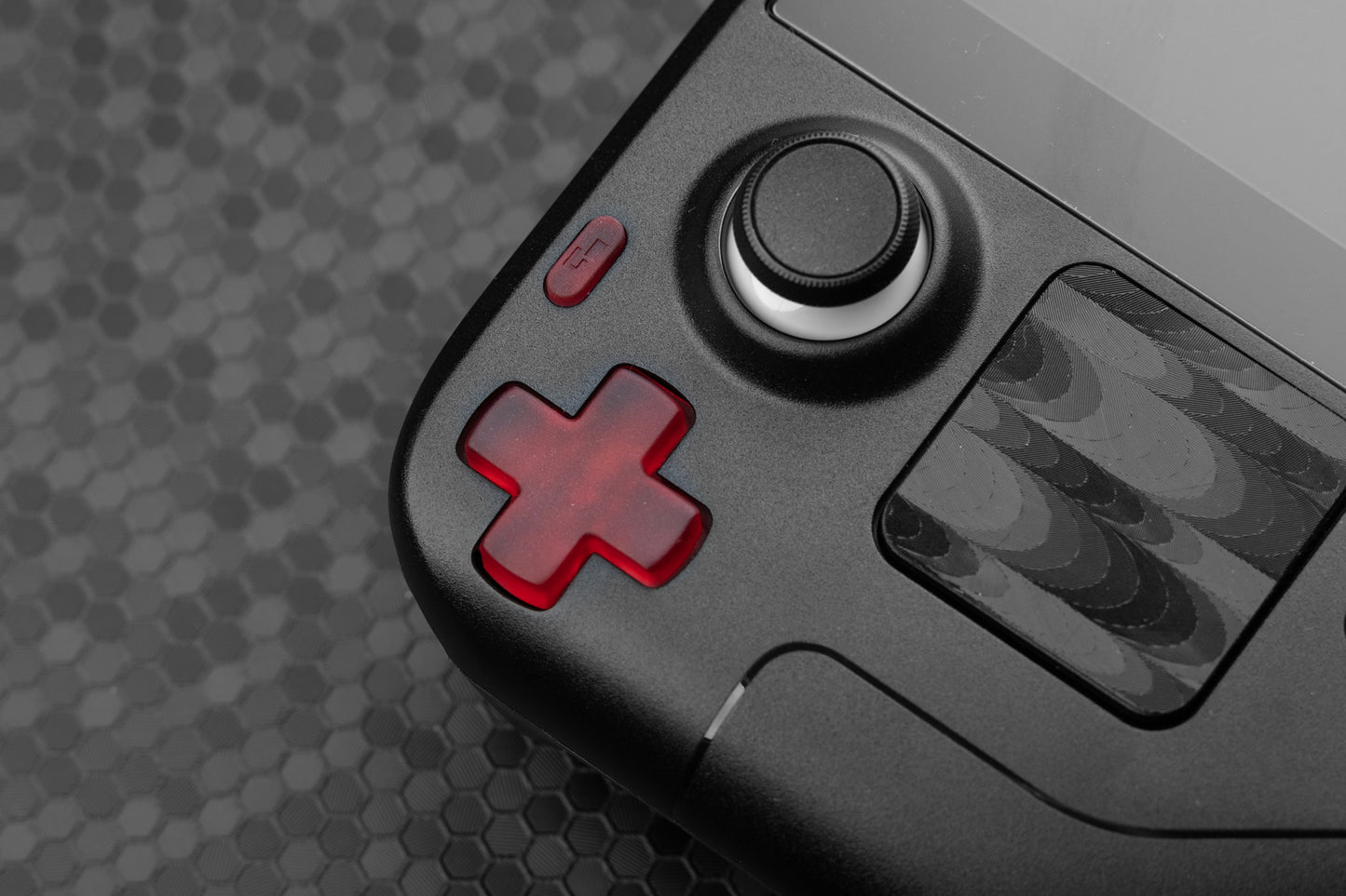 Close up of a transparent red dpad installed on a Steam Deck