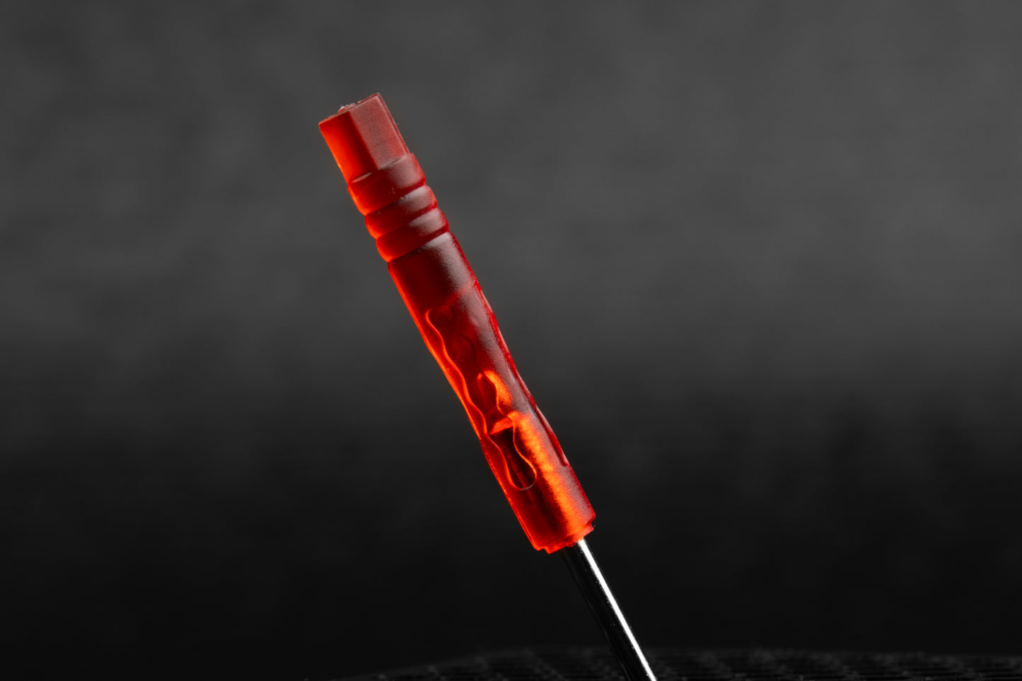 Close up of handle on transparent head red screwdriver