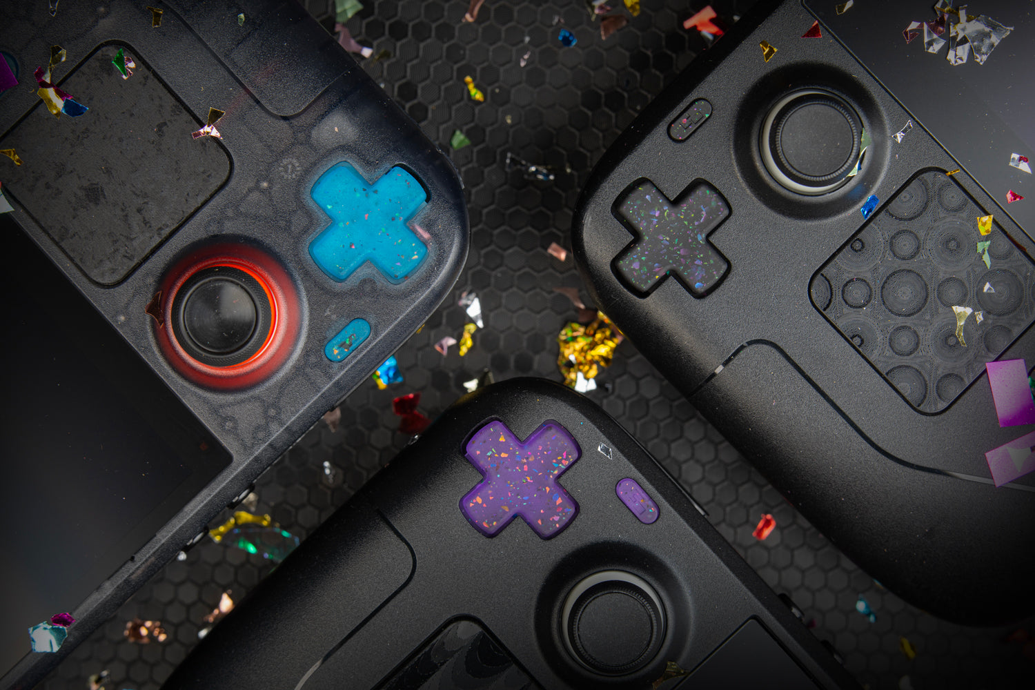 top down shot. 3 steam decks focused on dpads, confetti everywhere, party series installed blue purple black 