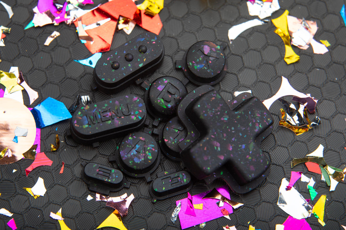 party black steam deck button set in a pile on hex background and confetti