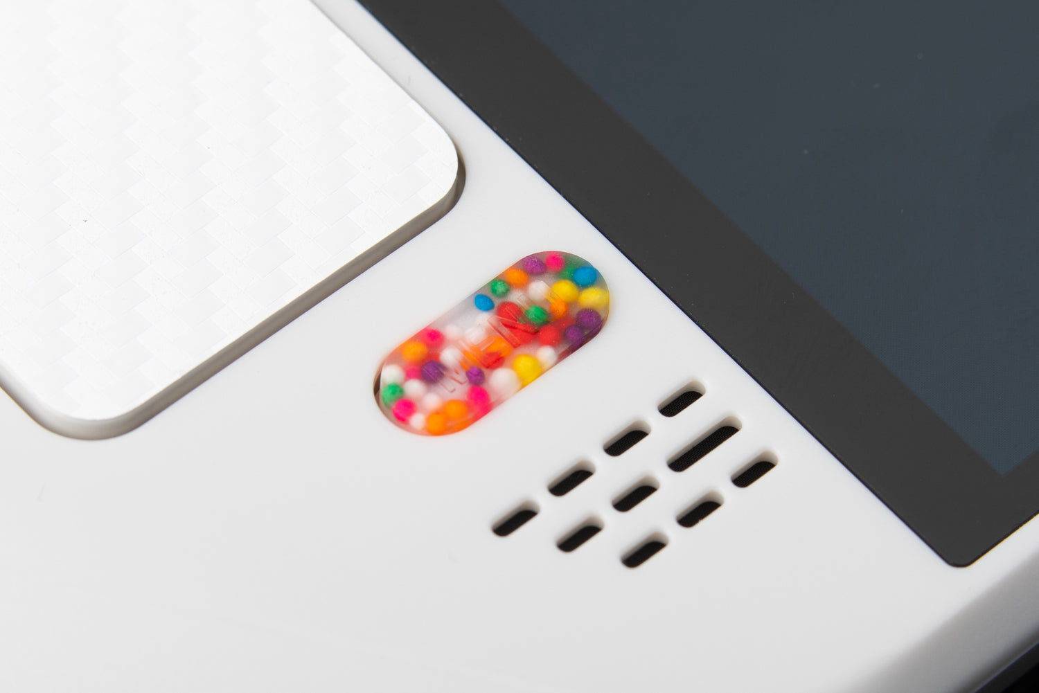 close up of menu button with sprinkles inside on a white steam deck 