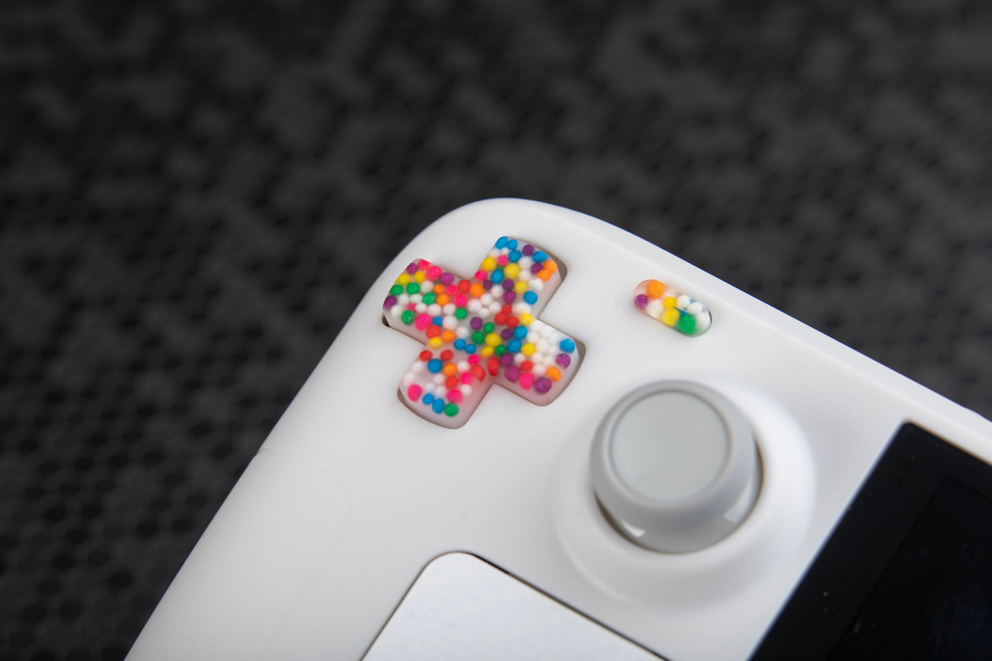 close up of steam deck dpad with sprinkles inside white steam deck