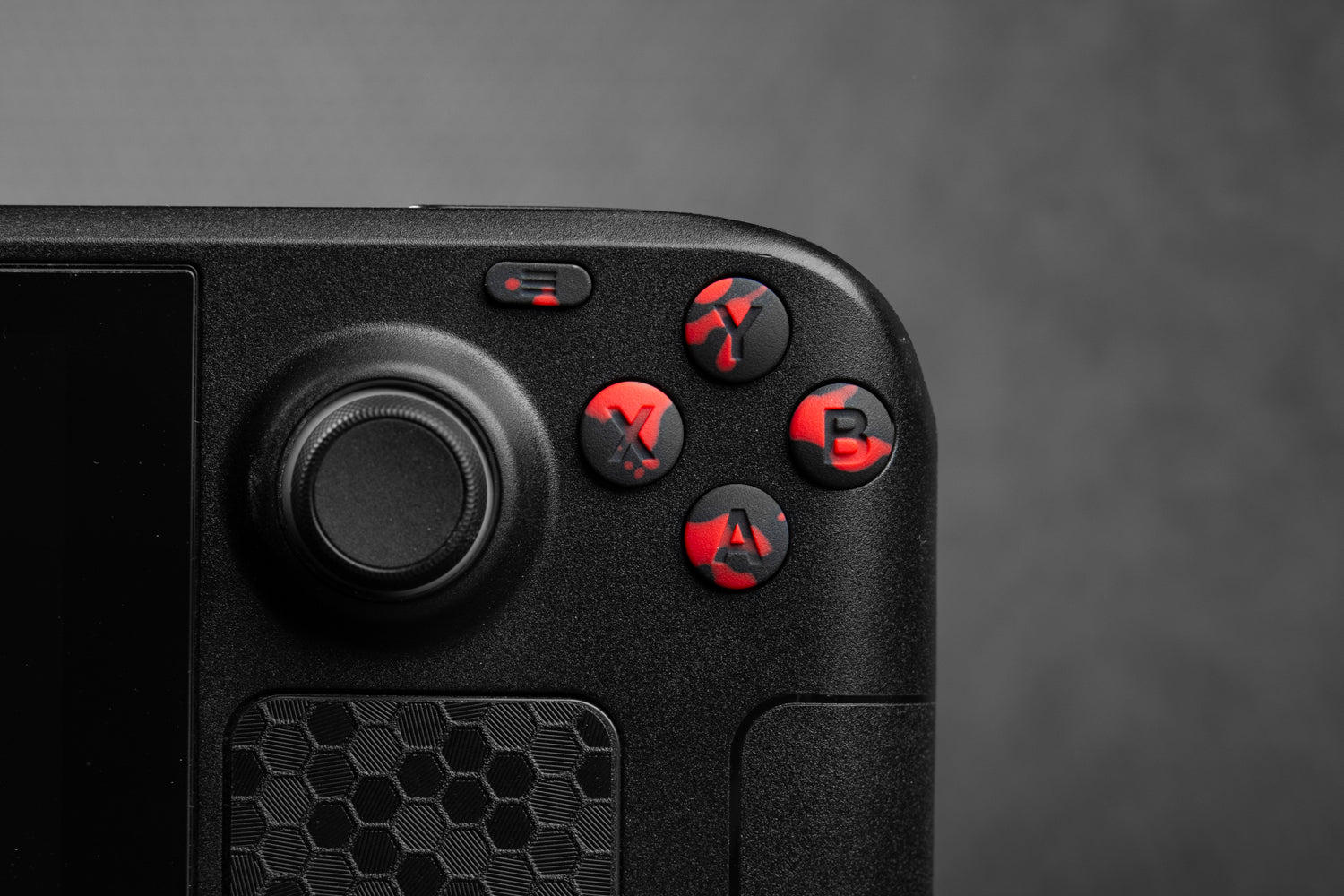 closeup of abxy black and red blood splat buttons installed on steam deck