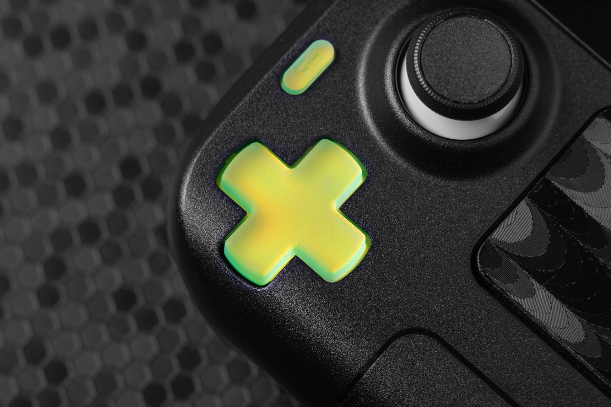 close up of dpad installed on steam deck green yellow blue holo