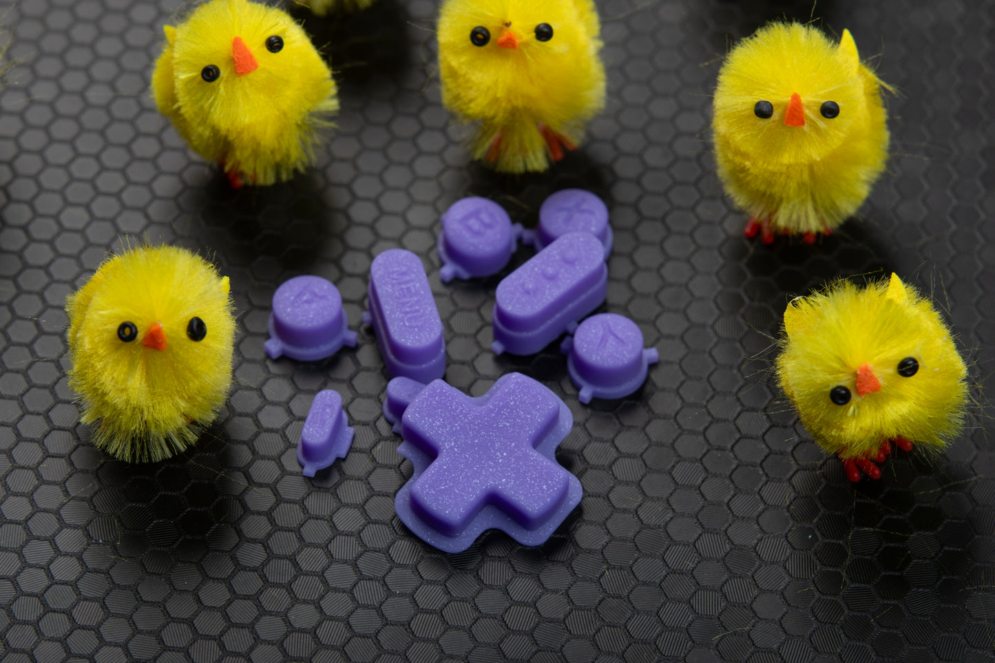 purple sparkly steam deck buttons with little chicks around them for easter