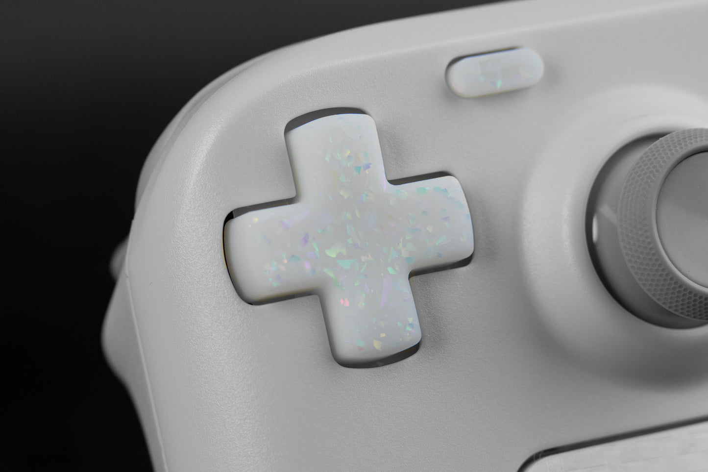 Close up of white holographic flake dpad on steam deck