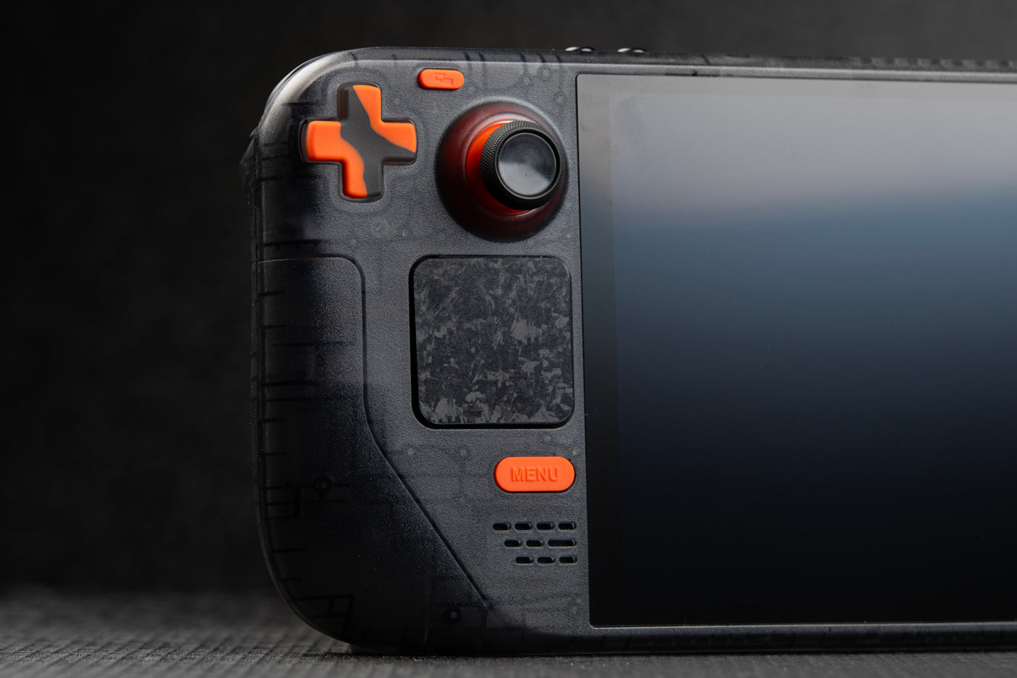 left side of steam deck showcasing LE edition orange and grey dpad and buttons